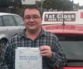 Thomas with Driving test pass certificate